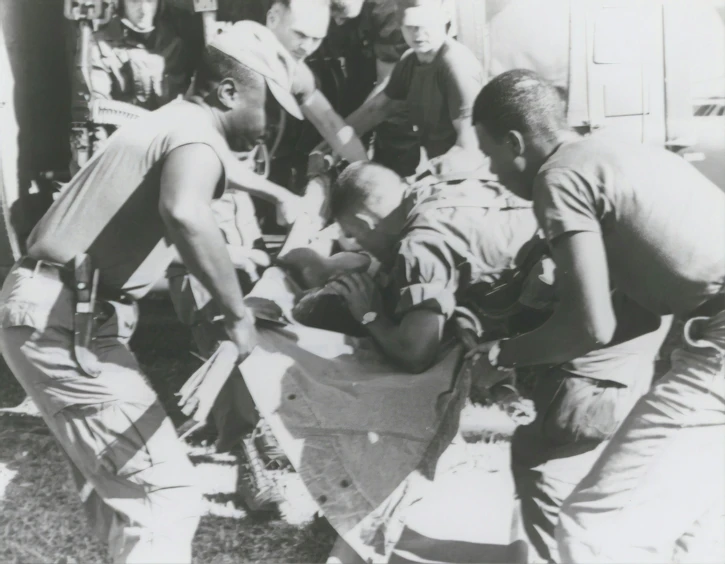 vintage black and white po of men performing an operation