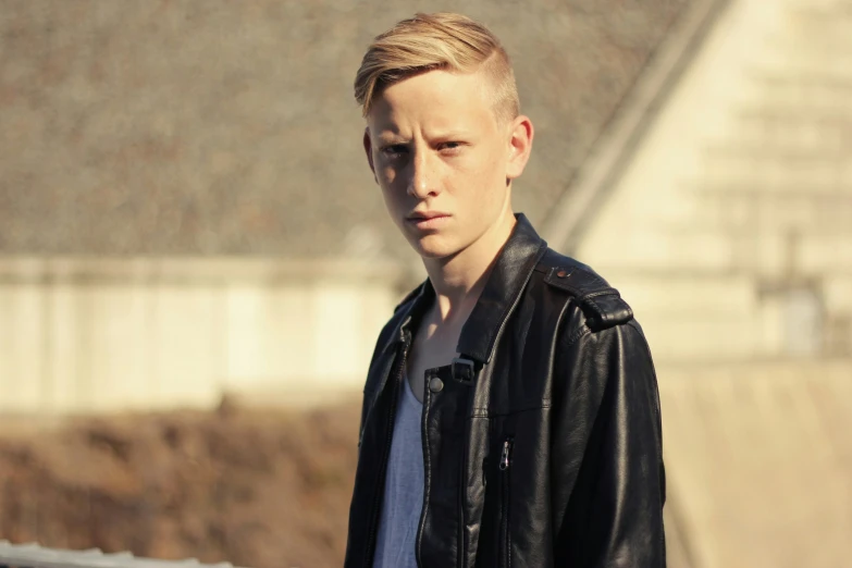 a man in black jacket next to roof