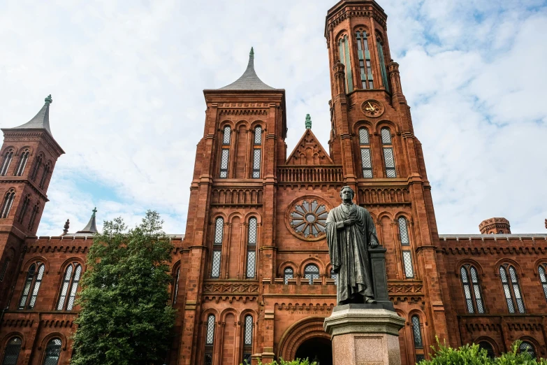 a church with a statue in front of it