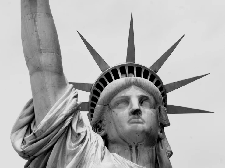 the statue of liberty is holding its hand up in the air