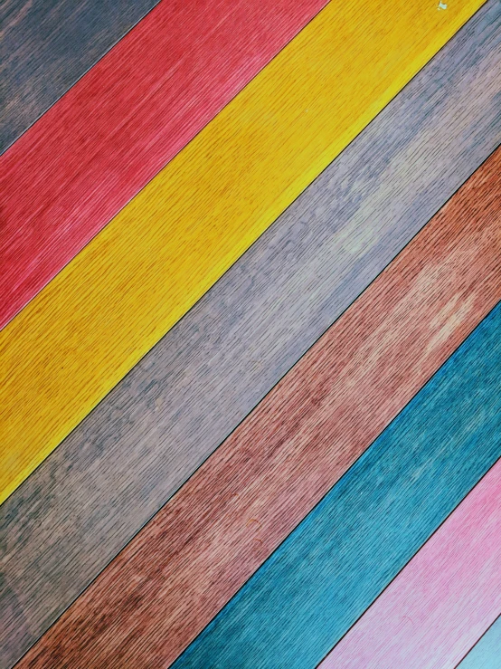 a brown bear stands on top of a multi - colored carpet