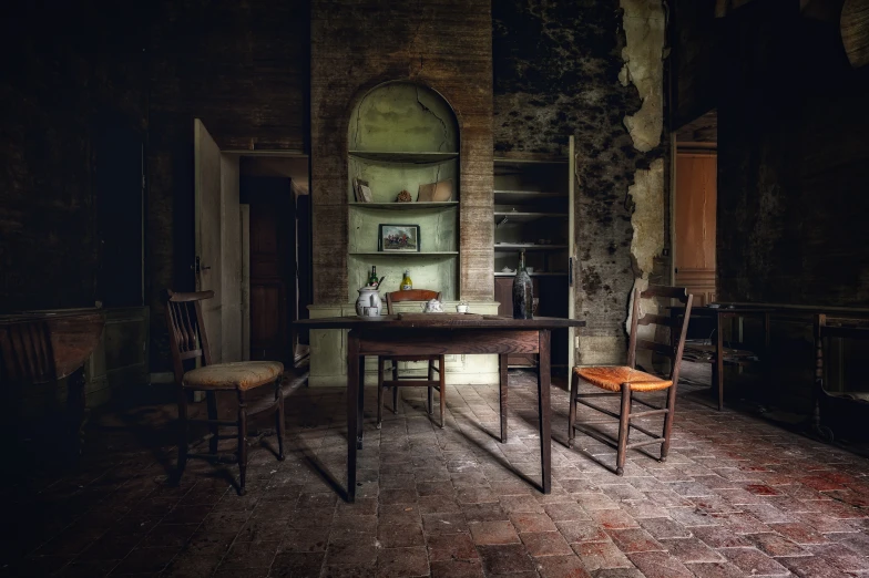 an old - fashioned desk with chairs and an arch doorway