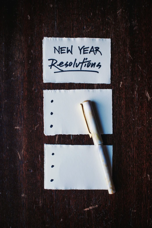 an end of a new year resolution note with a pen