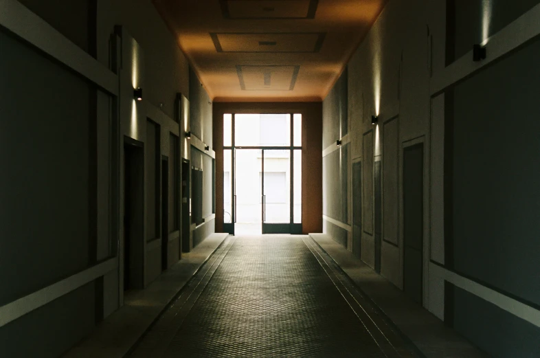 long corridor leading to open windows at night