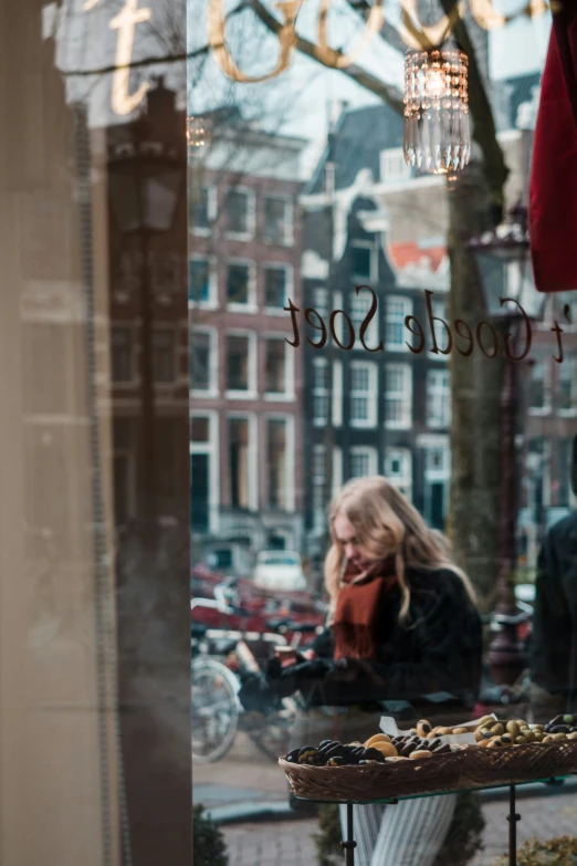 the reflection of a woman with long hair in the window