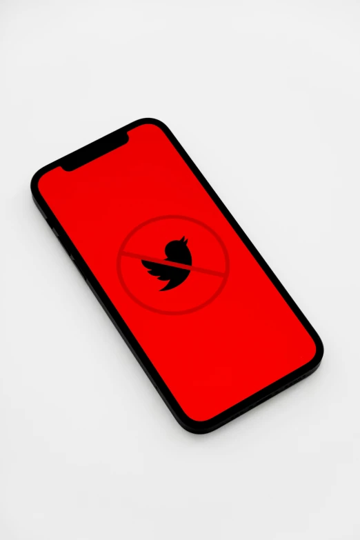 a red phone with a black bird logo