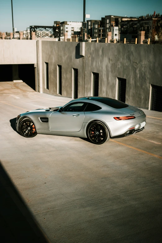 a silver sports car parked on the road