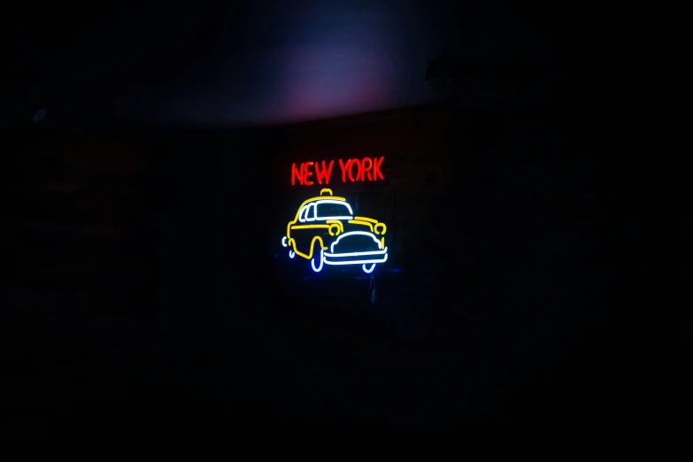 neon new york taxi in the dark with no roof