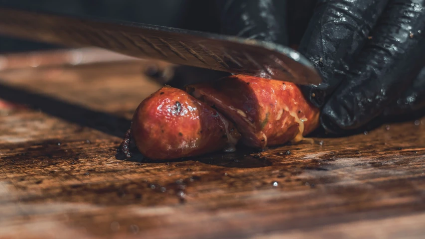 this is a closeup of a blade and a sliced apple on the table