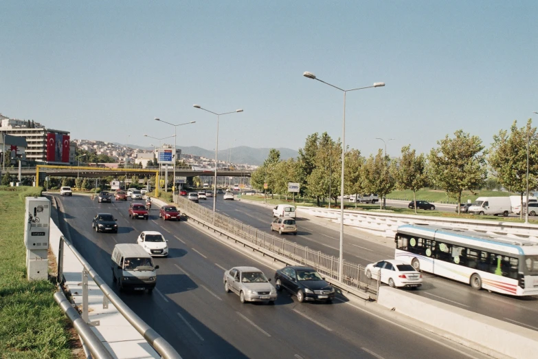 cars driving on an expressway with multiple lanes