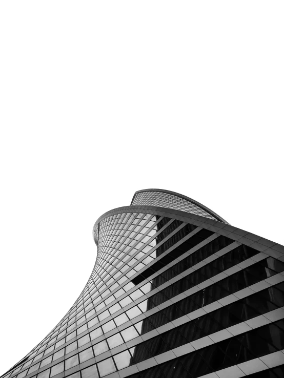 black and white po of a tall building with a plane flying