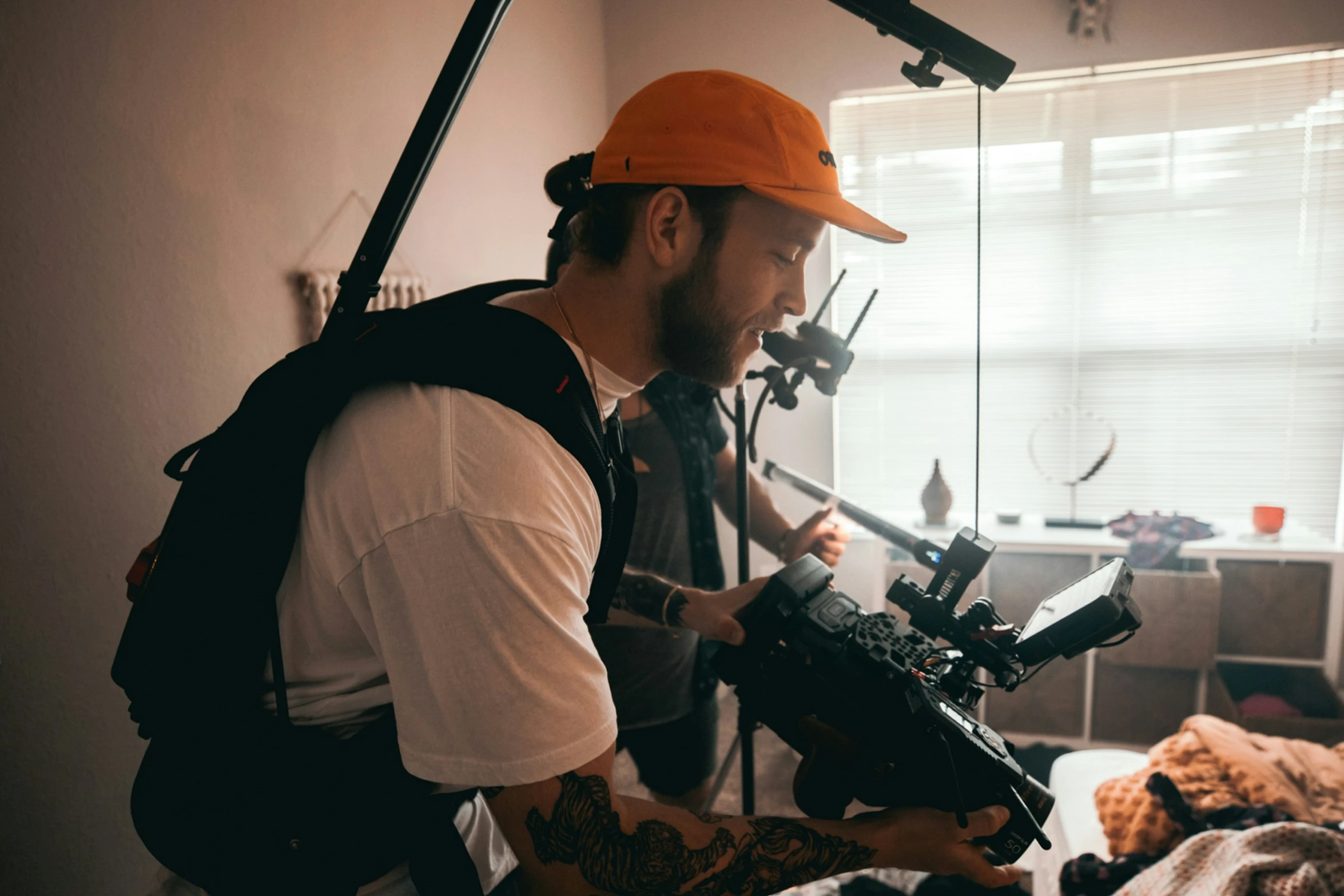 man with beard looking at camera and recording