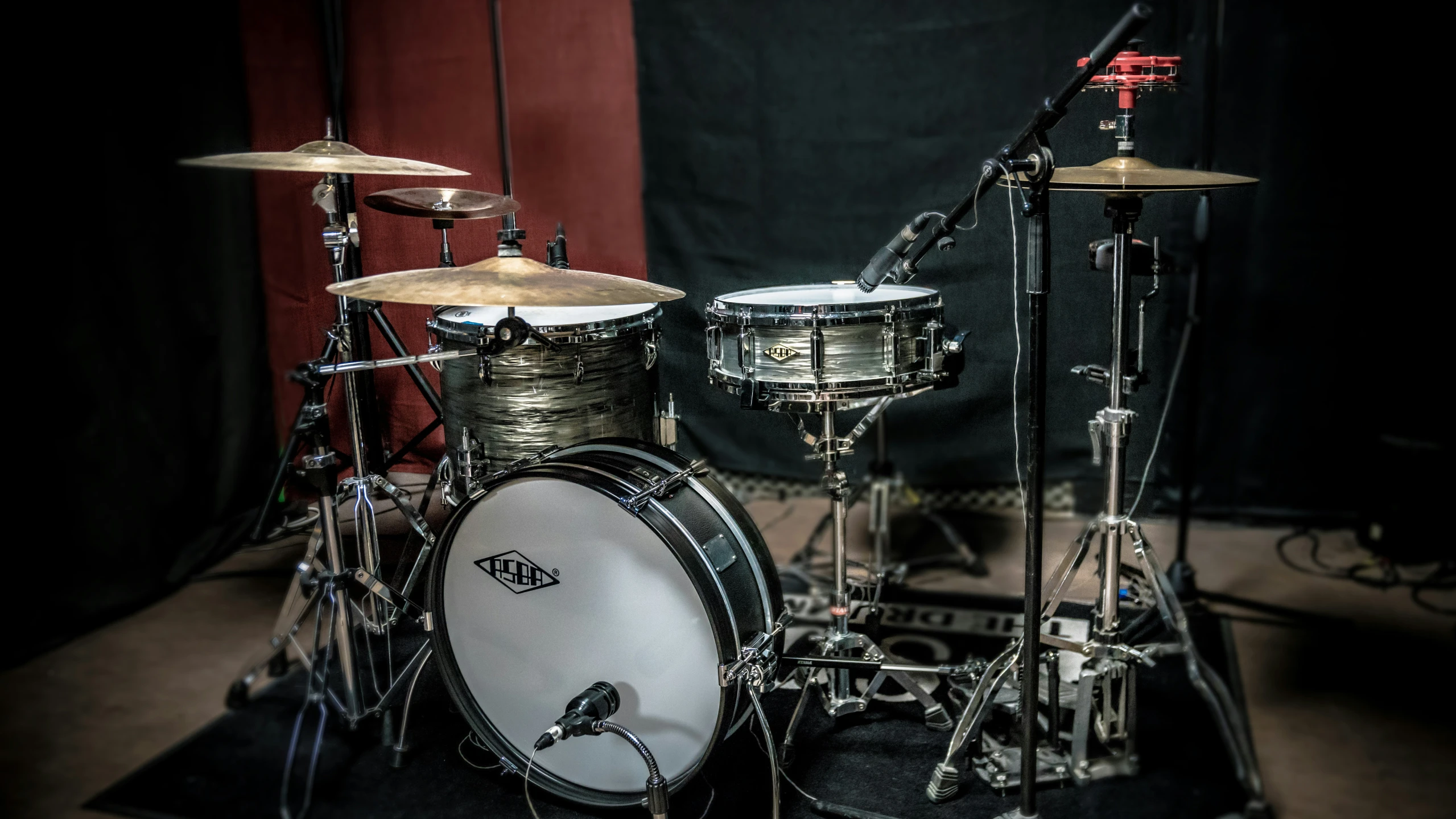 an old black drum set is seen in this image