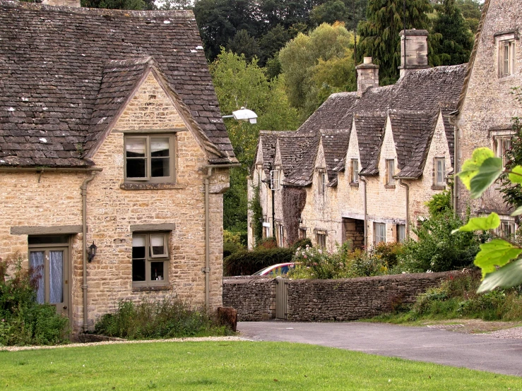 this is an old house with a stone wall