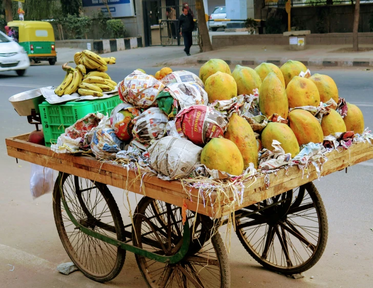 a cart full of different types of fruits