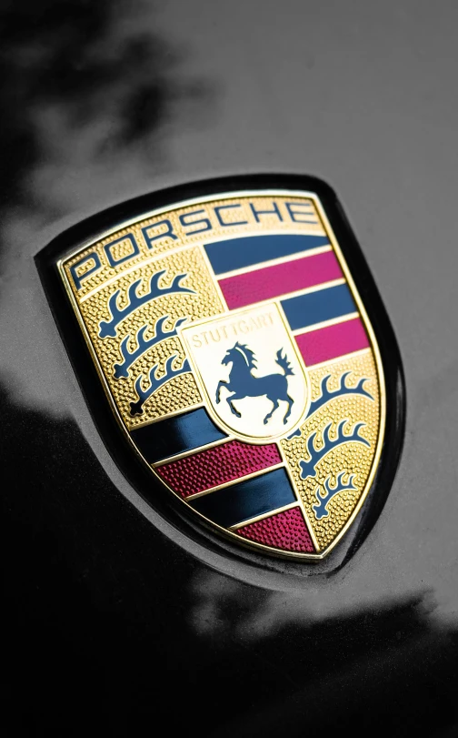 an emblem on the back of a porsche vehicle