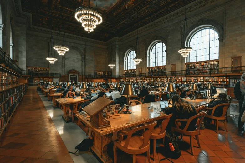 a liry filled with lots of wooden tables