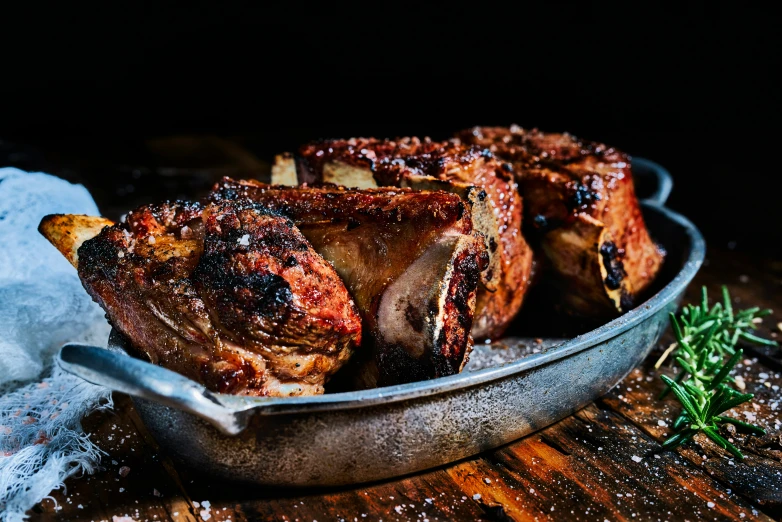 a pan of meat with some sort of topping on top