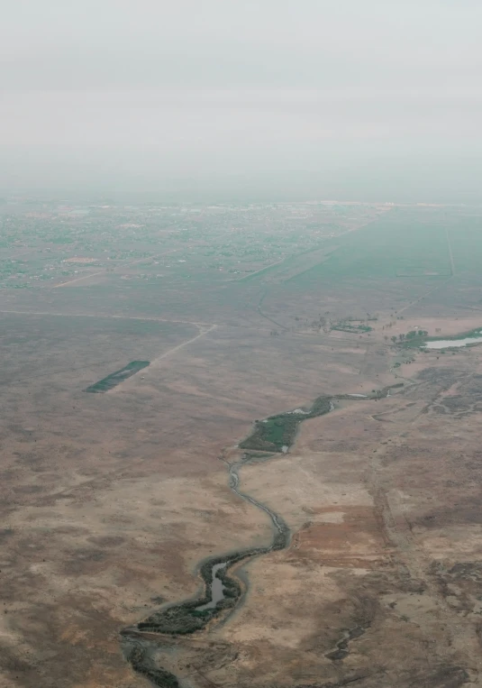 an airplane is flying over a vast landscape