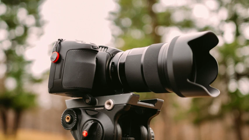 a camera sitting on top of a tripod