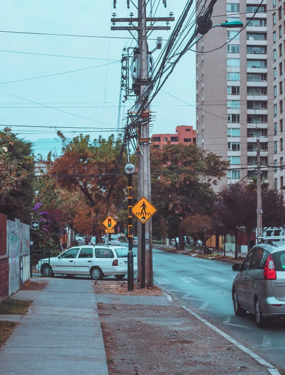 cars parked at an intersection on a city street