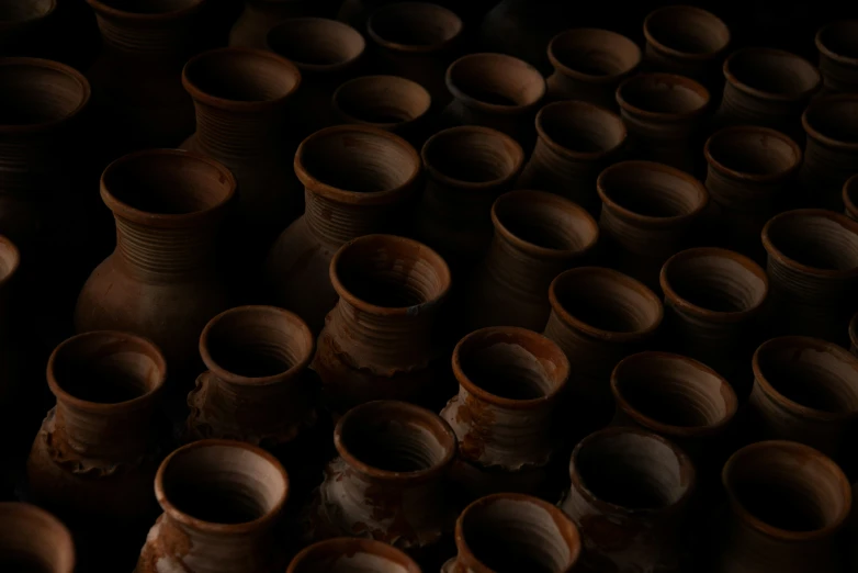 many vases piled together in an old pottery workshop