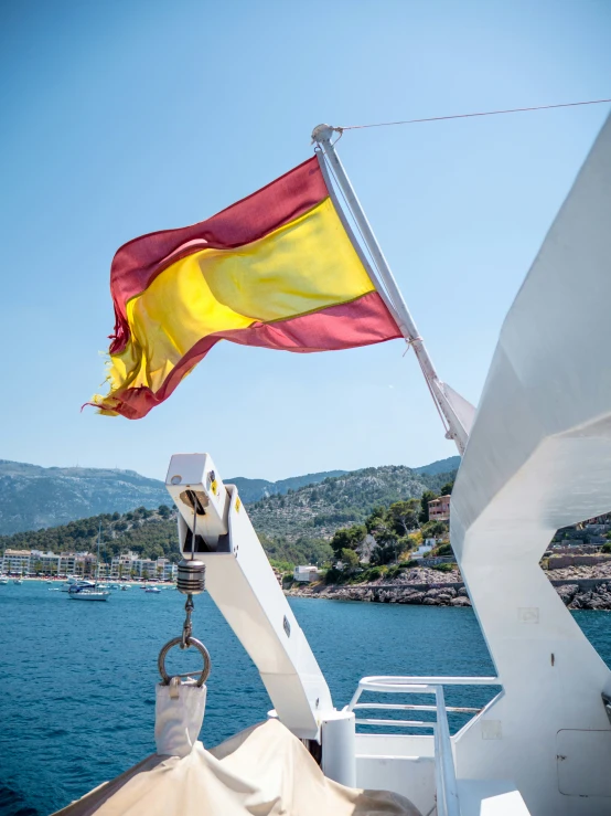 a flag on a boat in the water