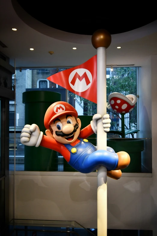 a mario statue is placed in a window