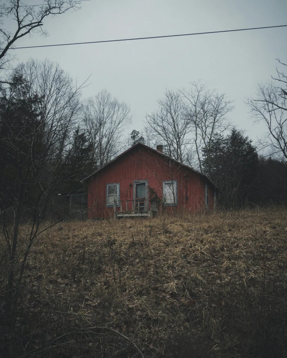 a red barn on the side of a road