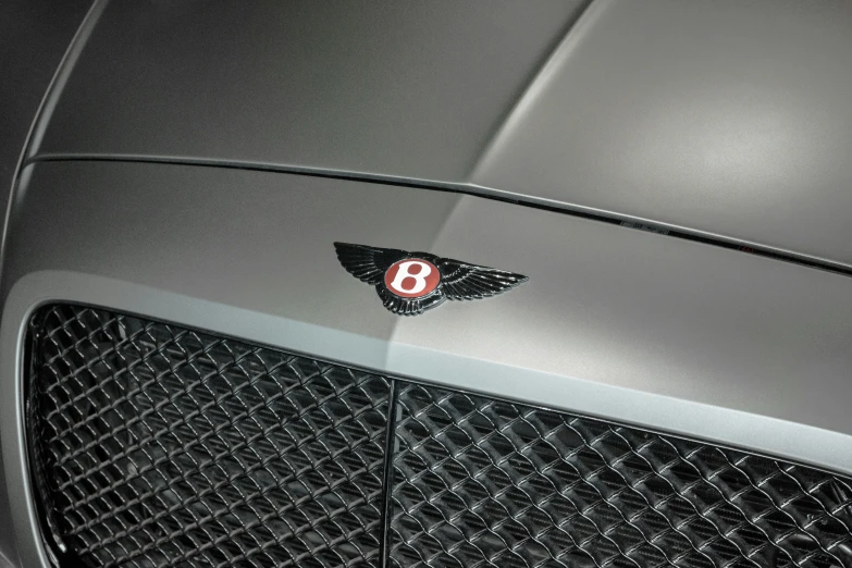 the logo on a black bentley with red lettering