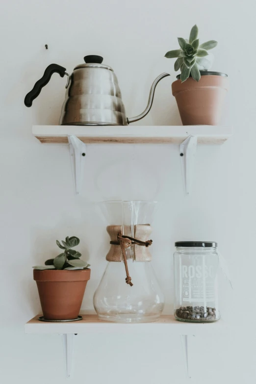 a couple of pots that are on a shelf