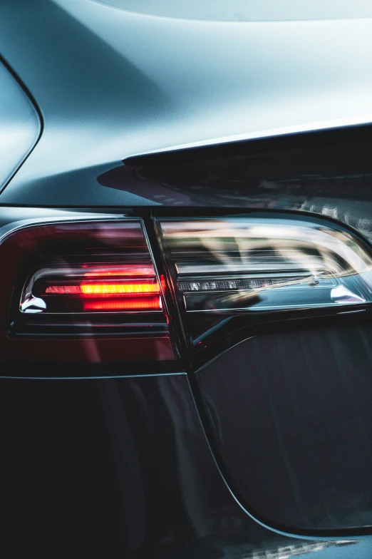 a close up of the tail light on a parked car