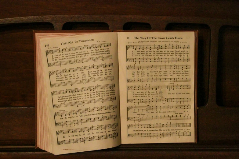 a book with a musical score and the words in the pages