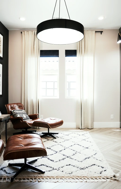 the living room has a circular ceiling light fixture