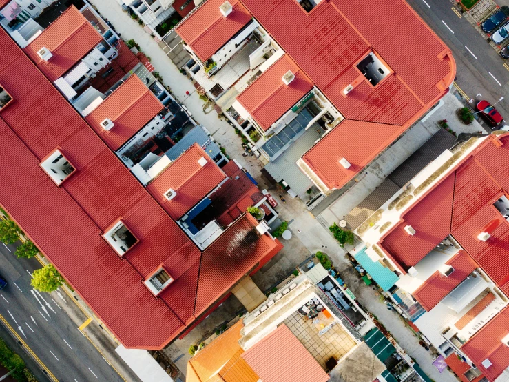 a street view of houses that have been painted orange