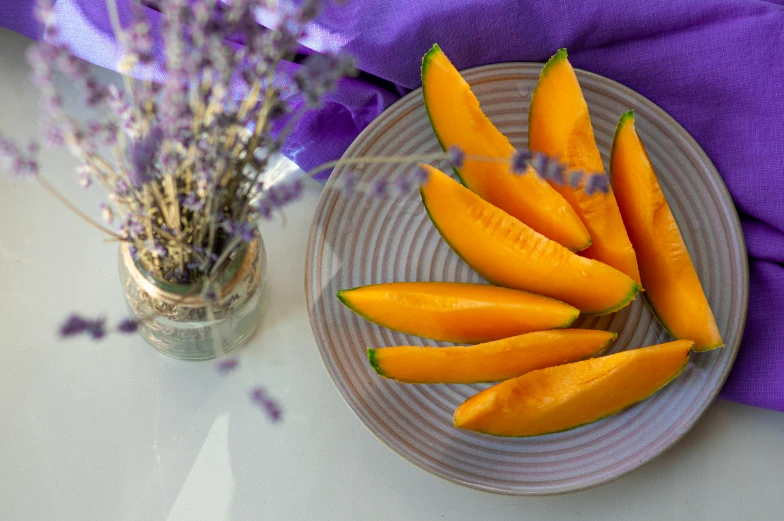 there are many small yellow peppers on a plate