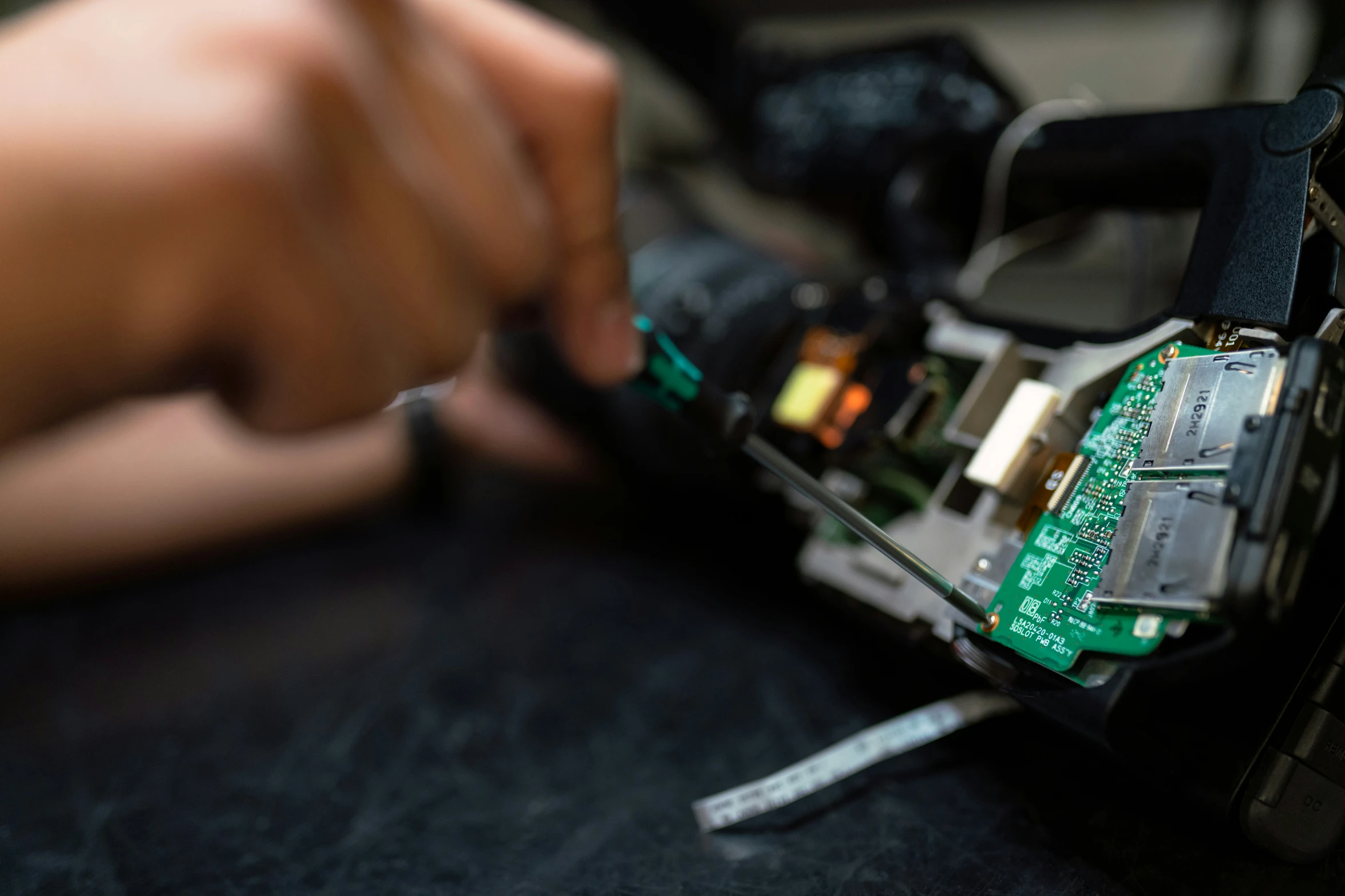 a woman is working on some electronic equipment