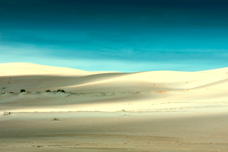 a beautiful view of the sky, sand and hills