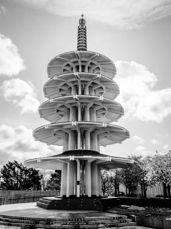 the spirally shaped fountain is sitting in the middle of a lot of stairs