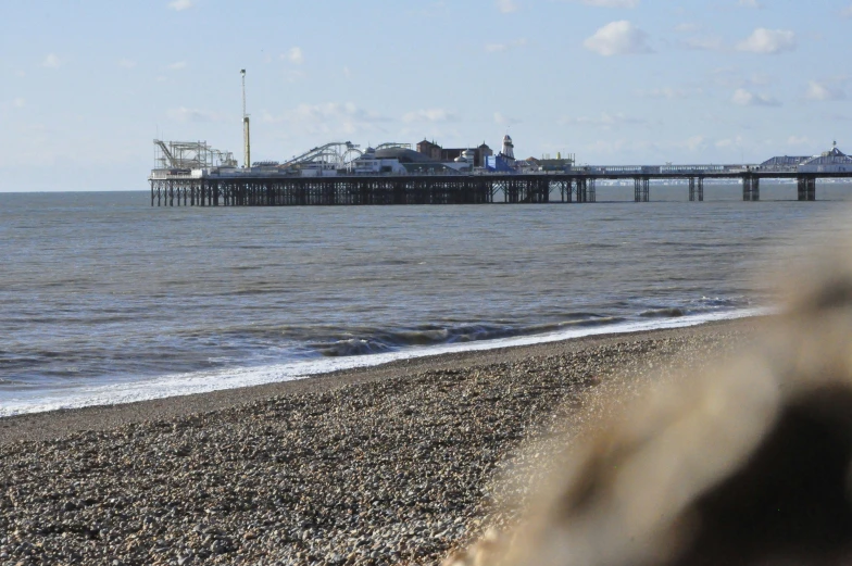 a view of a pier on the ocean