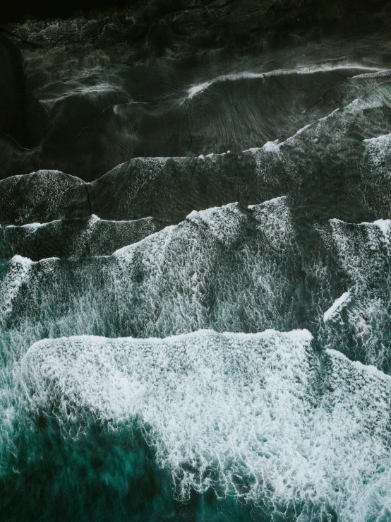 a surfer riding on top of an ocean wave