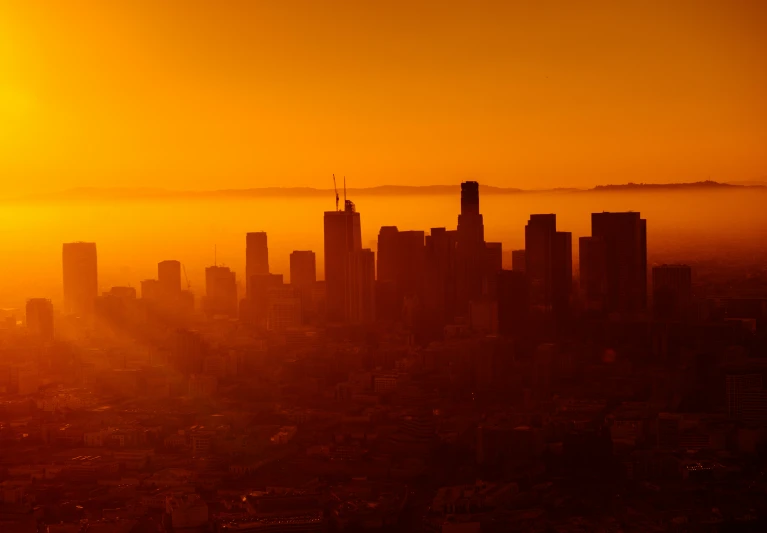 an image of the city skyline that appears to be smogged