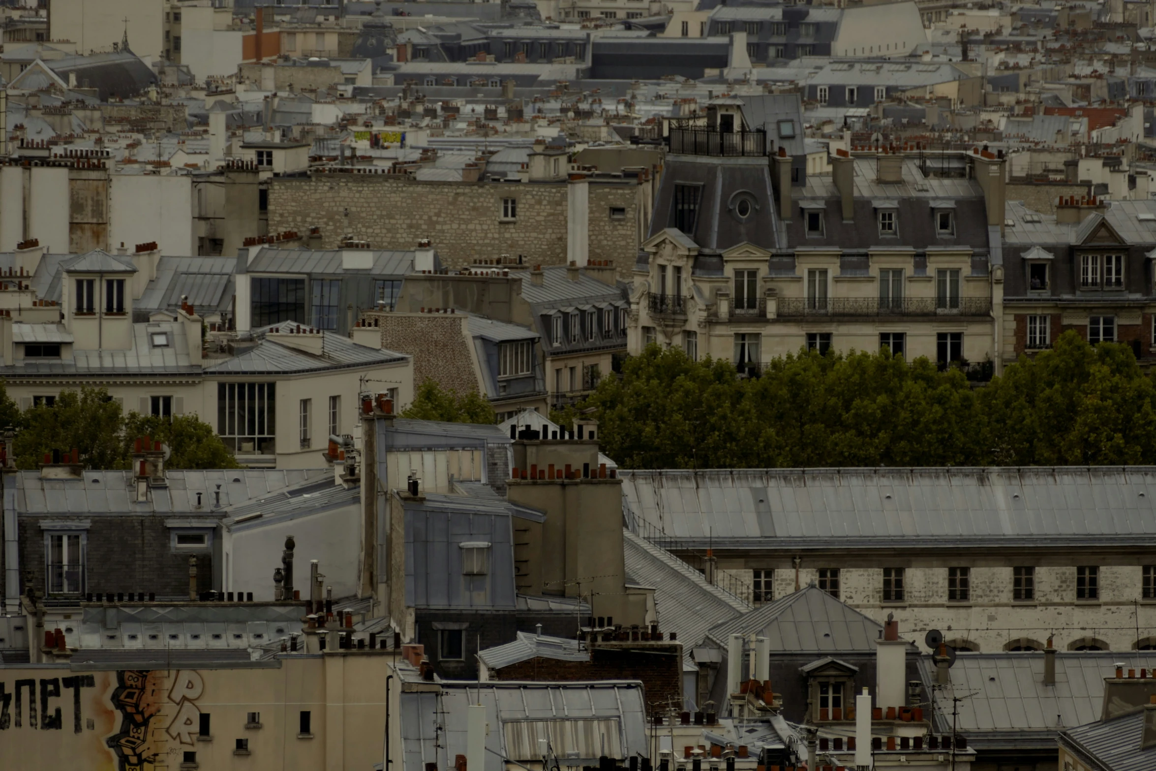 a city is filled with lots of gray buildings