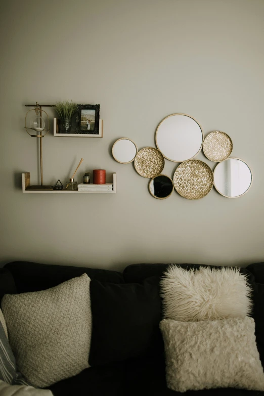 a living room with plates and other items on the wall
