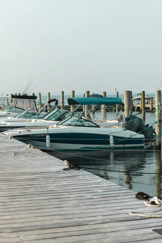 a row of boats are parked at a dock