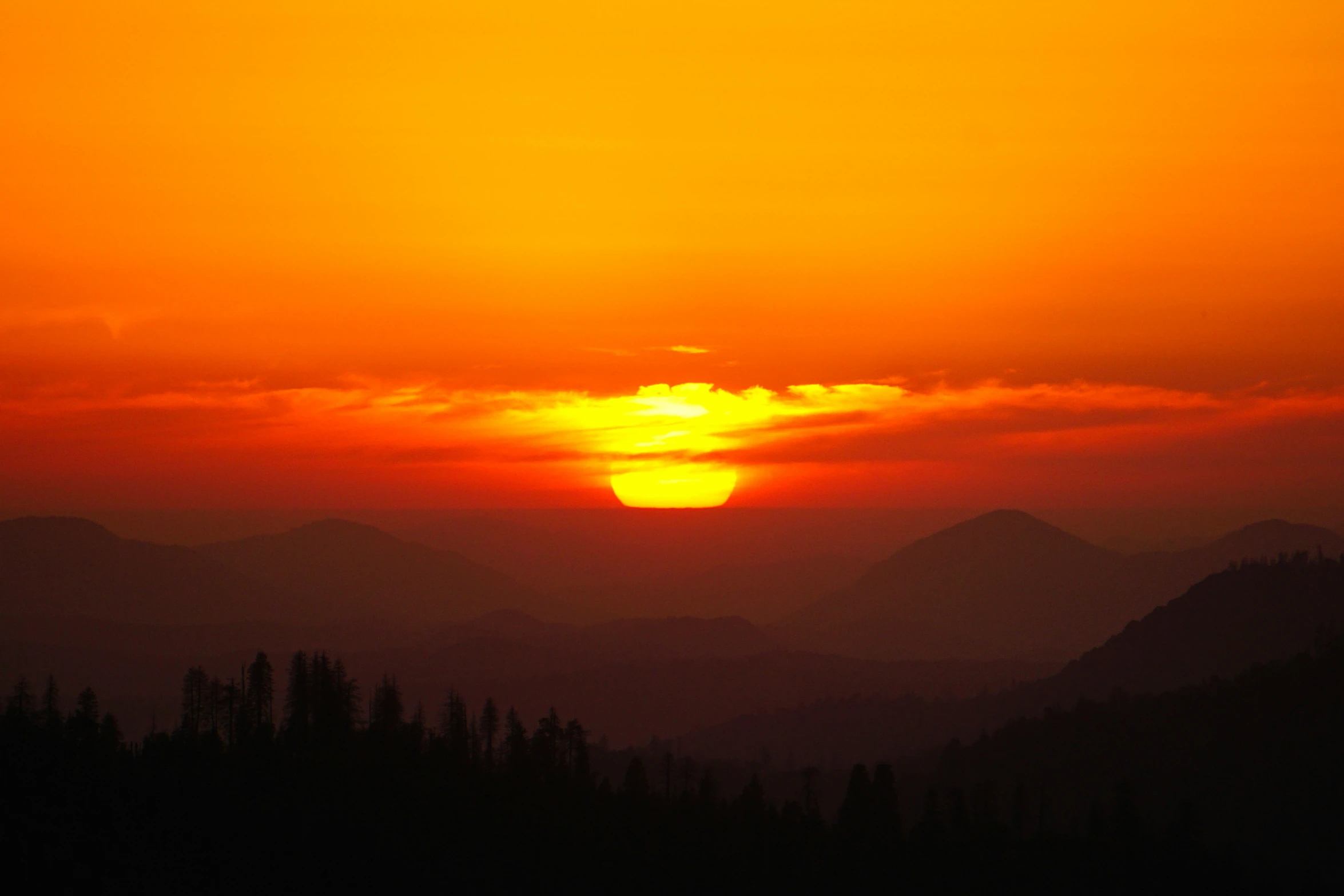 there is a very colorful sunset seen in the mountains