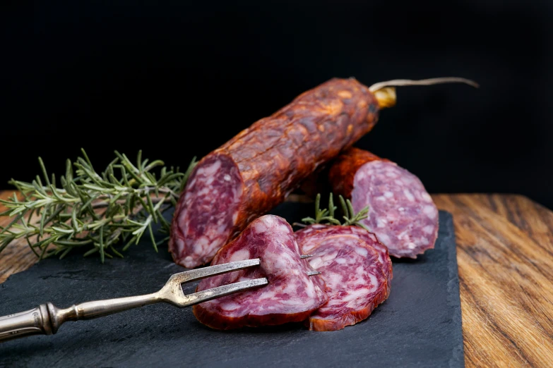 sausage and a sausage knife on a  board