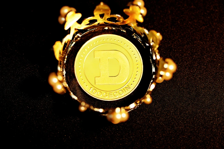 the gold coin is surrounded by small pearls