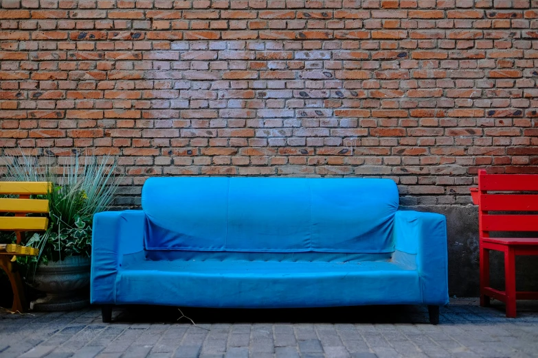 two chairs sitting in front of a blue couch