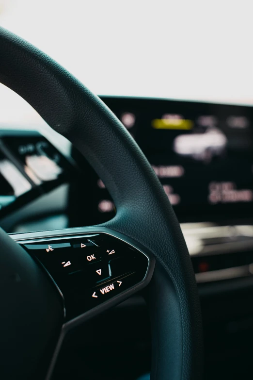 an inside view of a car with steering wheel control